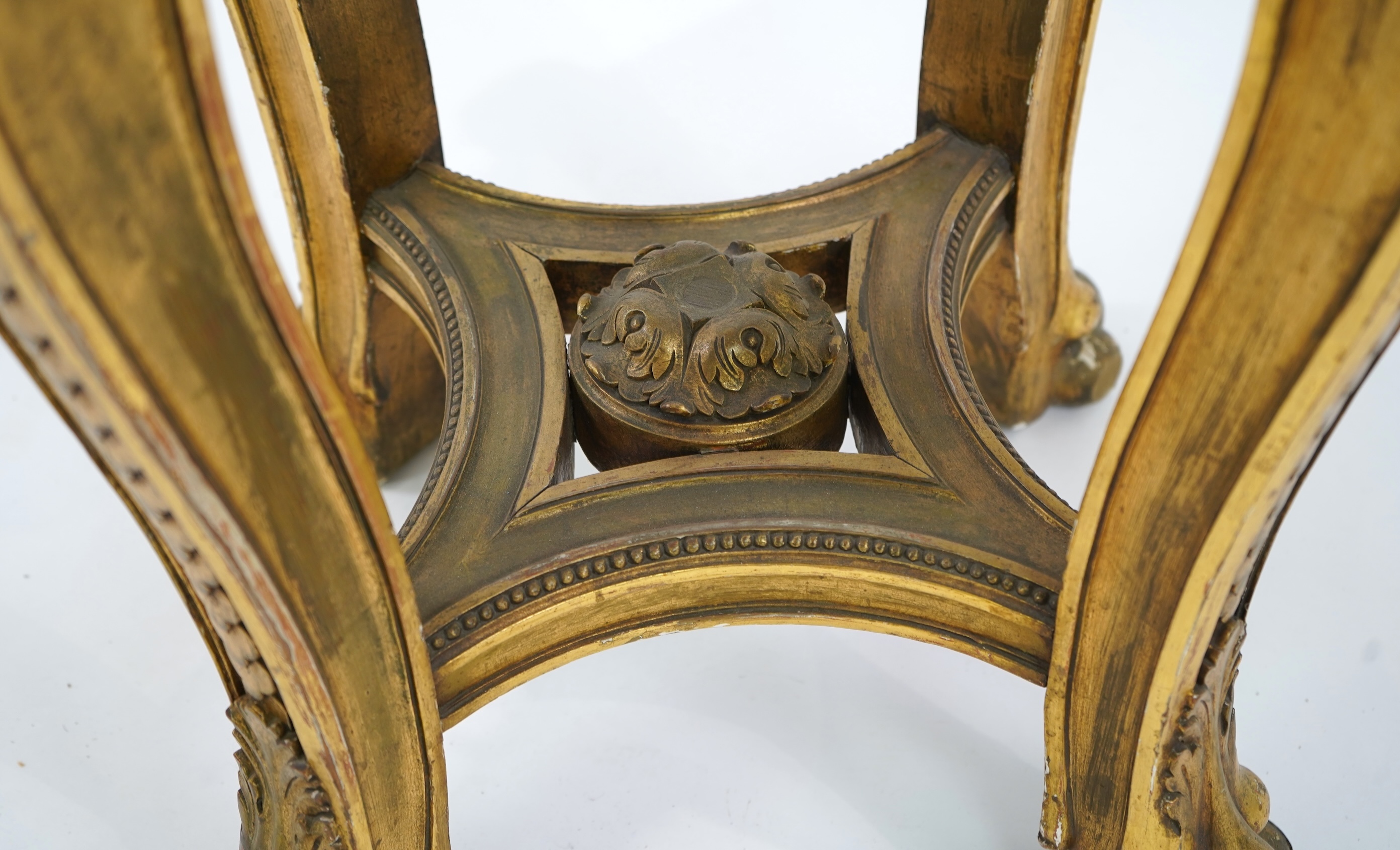 A late 19th century French circular carved giltwood and composition vase stand